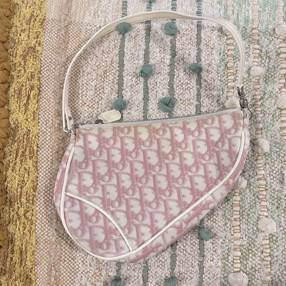 Baby pink vintage dior saddle bag.